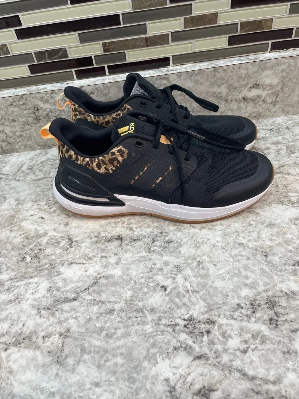 Adidas RapidaSport leapord print kids size 6.5